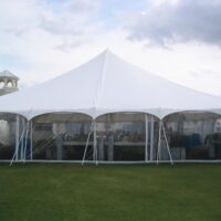 8' high clear sidewalls in a 60' x 60' pole tent.