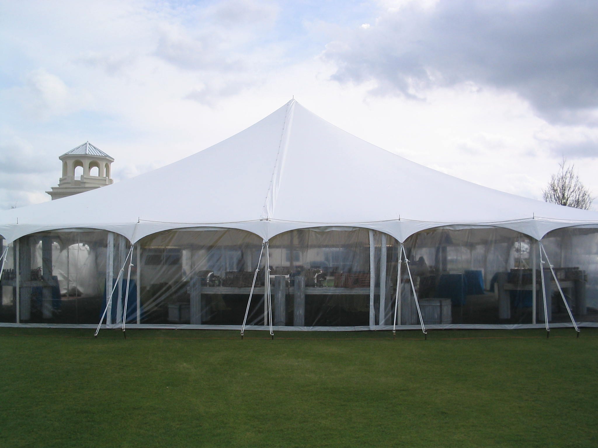 8' high clear sidewalls in a 60' x 60' pole tent.
