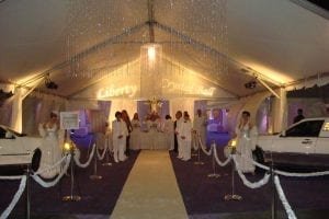 Crystal ball themed corporate event featuring a 30' x 40' entrance tent, custom gobos, models, and white stretch limos.