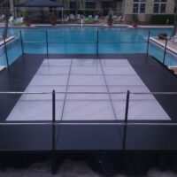Combination frosted acrylic and wood staging with safety railing used as a dance floor.