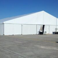 25m x 30m structure tent with with white sidewalls.