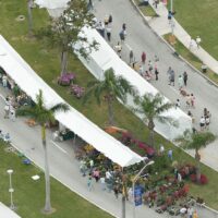 9' x 100' marquee tents used for outdoor covered booths at a flower show.