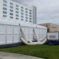 25 ton package a/c unit ducted into pvc hardwall panels in a 15m structure tent.