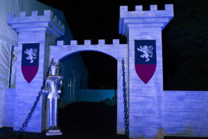 Medievel themed event featuring a custom built tower entrance and props.